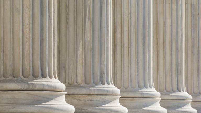 Architectural detail of marble ionic order columns